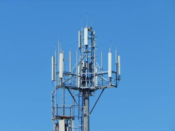 istock Communication antenna tower building with the sky background. Telecommunication aerial. Mobile phone communication antenna tower. 955010348