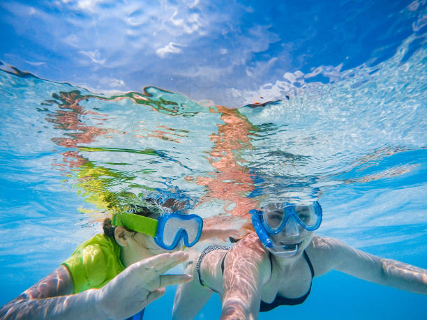 istock Mother and Daughter Exploring the Ocean Together 955011376