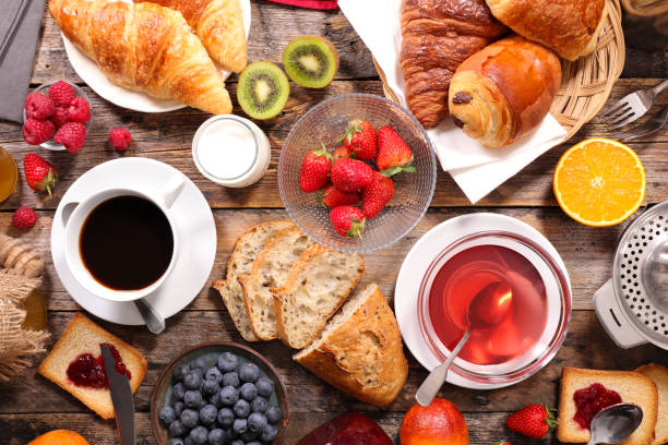 istock continental breakfast with coffee, tea and croissant 955014032