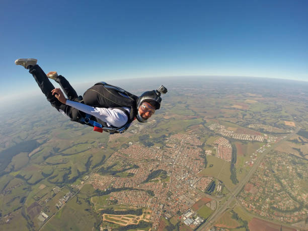 istock Very Happy woman jumping with parachute 955014176