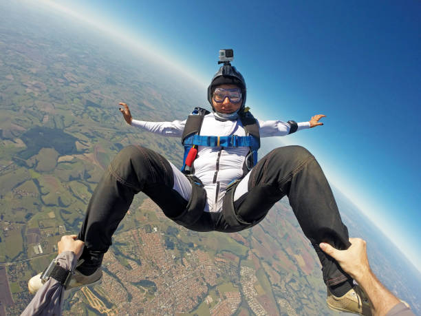 istock Very Happy woman jumping with parachute 955014194