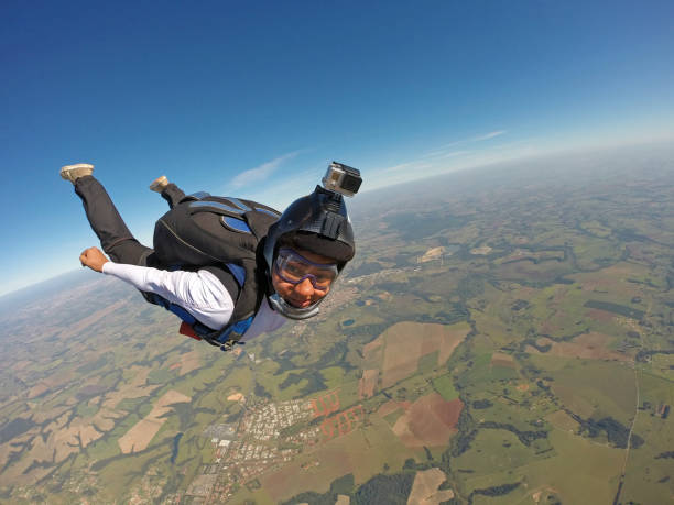 istock Very Happy woman jumping with parachute 955014232