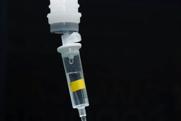 istock A drop of fluid from a bottle of normal saline 955014442