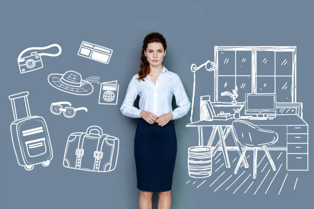 istock Calm secretary looking serious while planning her journey 955014722