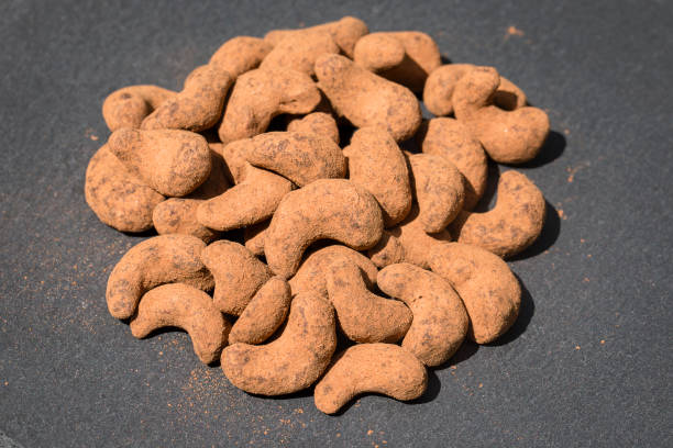 Cashew nuts covered with cocoa powder . Balinese dessert, Indonesia, island Bali