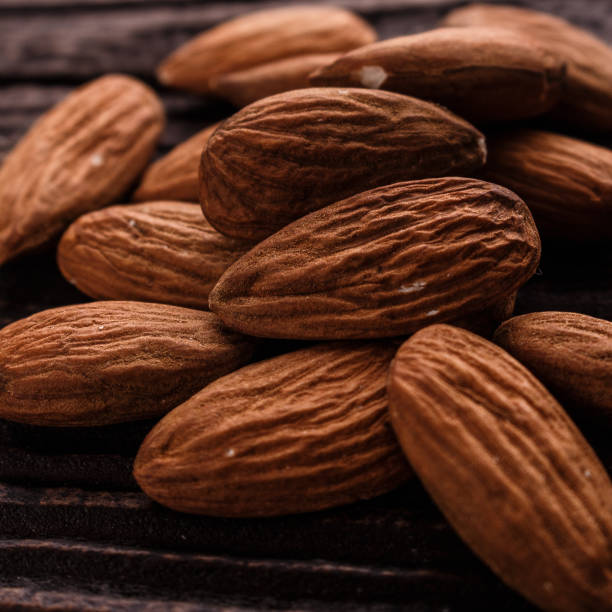 istock almond essential oil on a wooden background 955023846