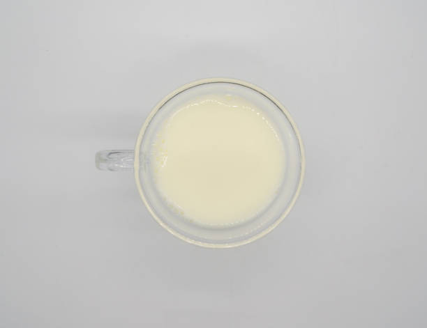 istock Fresh milk or soil milk in clear plastic cup with handle isolated on white background 955025468