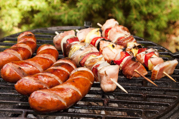 istock Grilling sausages and  shashlik. 955032864