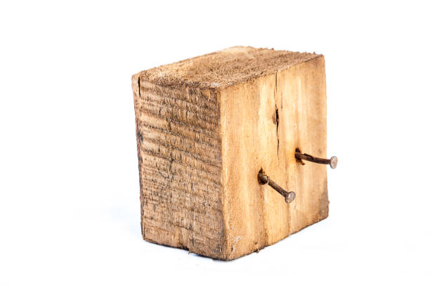 istock Big old dark cube is cut out from old wood. Isolated on white 955033902
