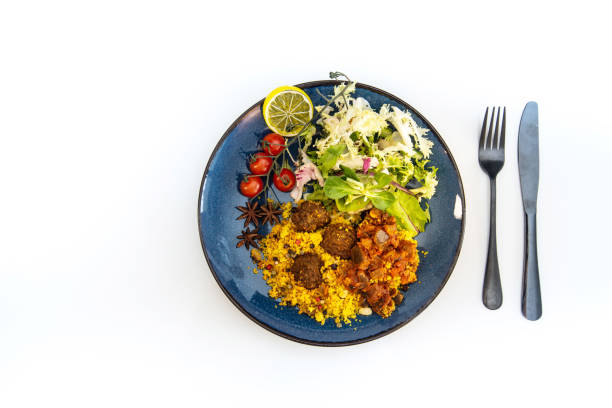 istock Kofta Tagine Moroccan Meatballs Served With Semolina and Vegetables 955040400