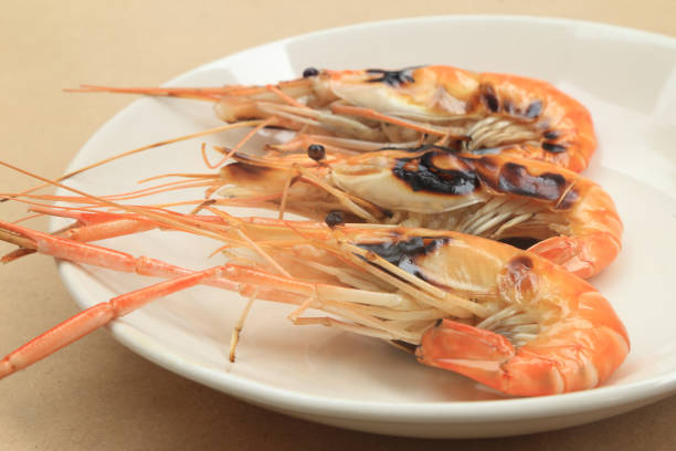 istock Roasted grilled prawn prepared on white plate. 955040640