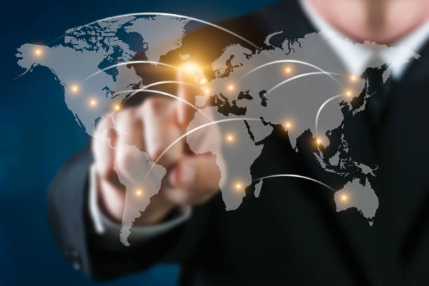 istock Business man touching a world map with connexions 955044562