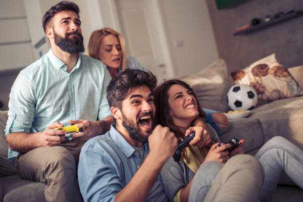 istock Friends having fun together at home 955046324