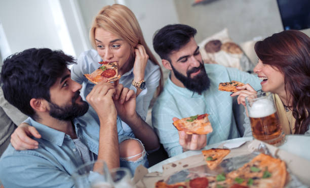 istock Friends having fun together at home 955046846