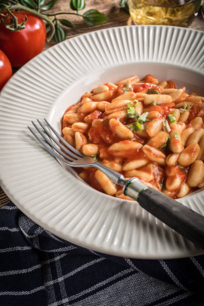 istock Cavatelli pasta with fresh tomato sauce. 955047136