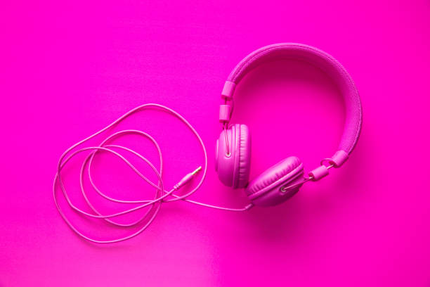 istock Pink hipster headphones on pink background. 955049942