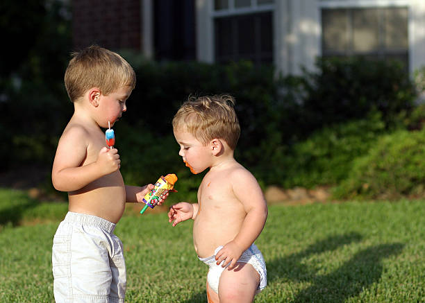 istock Brothers sharing ice cream, want a taste?! 95505744