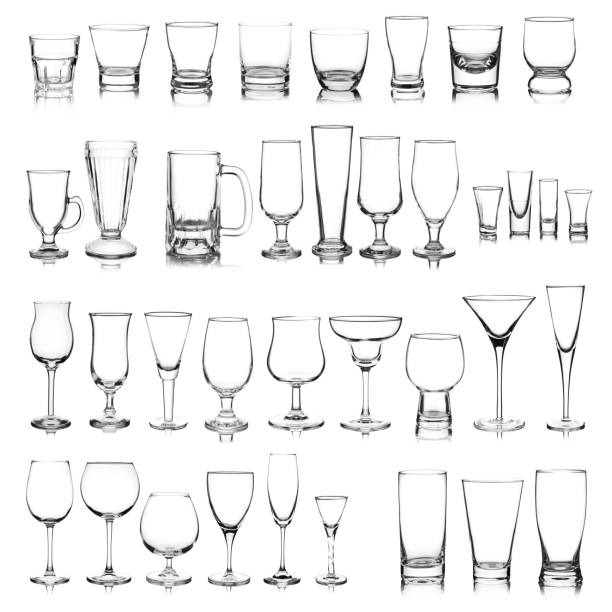 Glassware collection Large group of a variety of glasses isolated on white background. Composite image. martini glass photos stock pictures, royalty-free photos & images