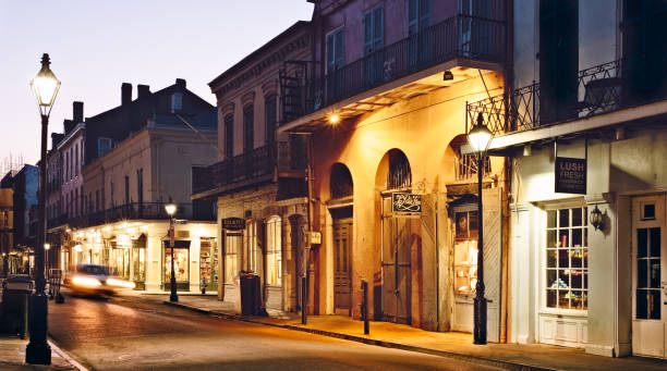 New Orleans French Quarter at dusk Royal and Toulouse streets in French Quarter, New Orleans at dusk french quarter stock pictures, royalty-free photos & images