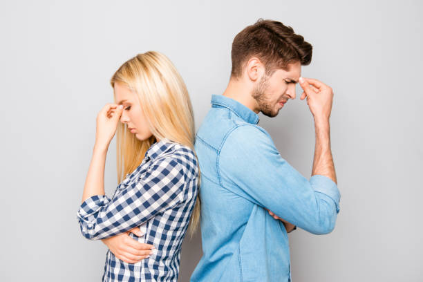 istock Man and woman standing back to back after quarrel 955065738