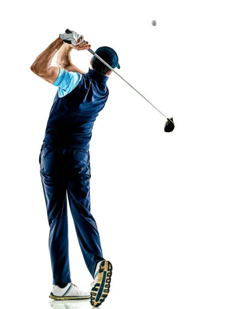 one caucasian man golfer golfing in studio isolated on white background