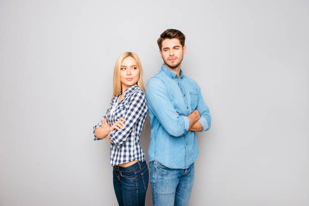 istock Young angry couple in love standing back to back 955066782