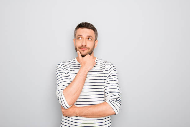 istock Successful thoughtful young businessman thinking about smth 955069768