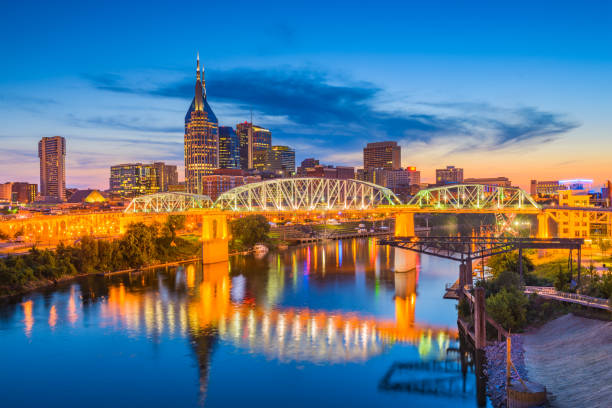 Nashville, Tennessee, USA Skyline Nashville, Tennessee, USA downtown city skyline on the Cumberland River. nashville tennessee bridge stock pictures, royalty-free photos & images