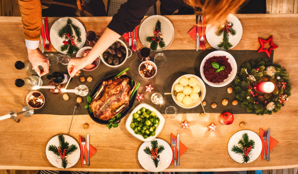 istock Friends prepare table for christmas party 955078212