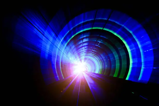 Abstract Speed motion through a tunnel