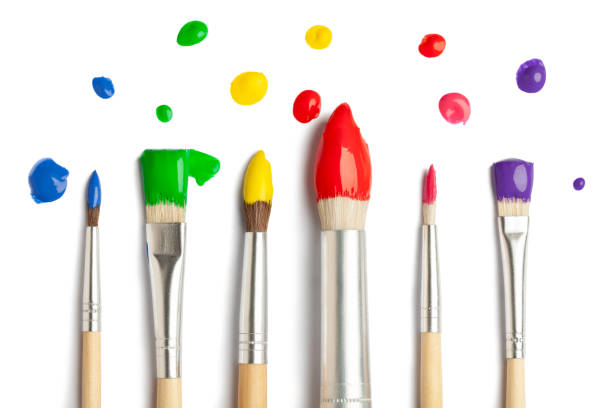 istock Colorful paint brushes on white background 955079950