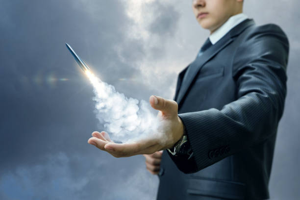 istock Businessman launches a missile from the hand. 955080532