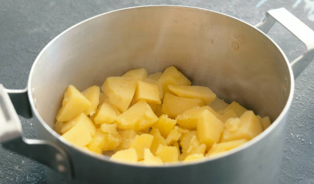 istock Closeup boiled potato in saucepan. Cooking mashed potatoes. 955084718