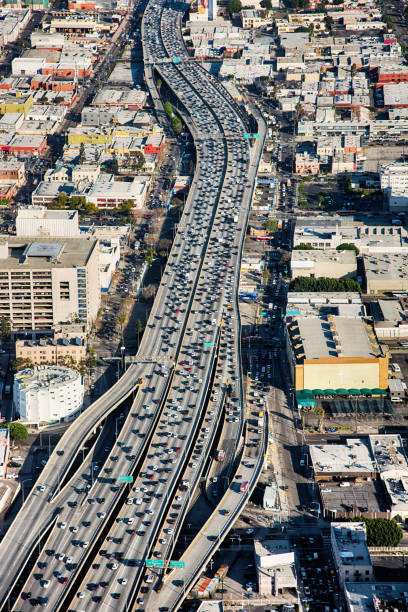 Los Angeles Traffic Jam Heavy traffic common to the Los Angeles freeways here during rush hour on Interstate 10 near downtown. los angeles traffic jam stock pictures, royalty-free photos & images