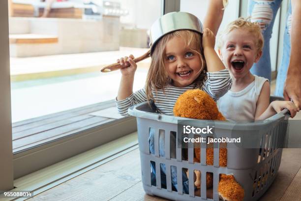 Kids Rides In A Laundry Basket Stock Photo - Download Image Now - Child, Laundry Basket, Basket