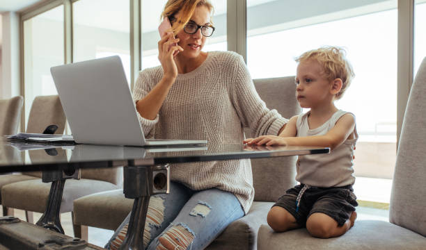 istock Mother with son working from home 955088164