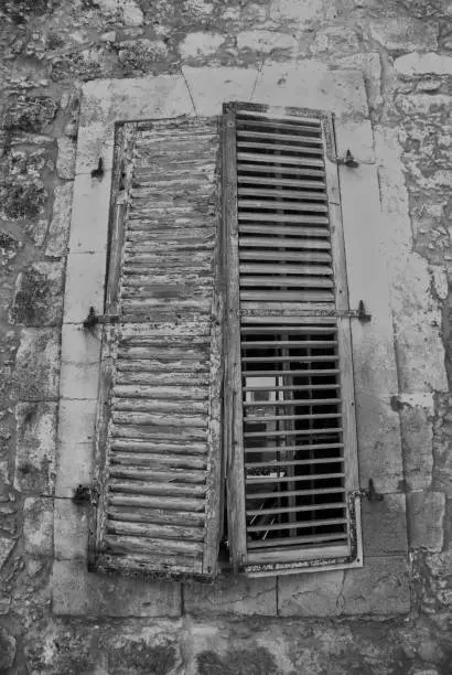 Wooden shutters on a window of a stone building in Kyrenia, Northern Cyprus