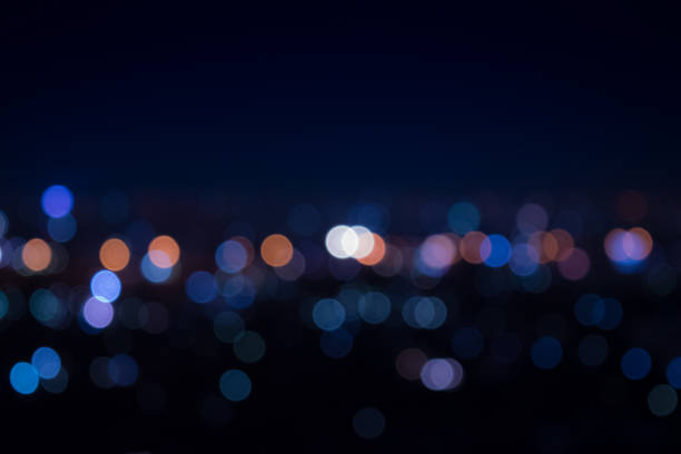 luz por la noche en la ciudad azul bokeh - city urban scene night lighting equipment fotografías e imágenes de stock