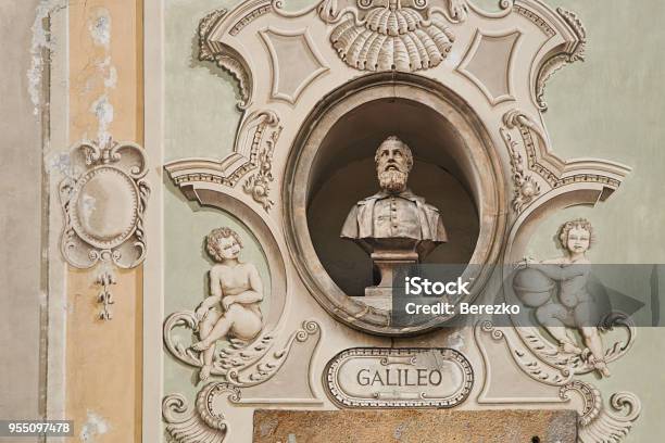 Vintage Sculpture Portrait Of Galileo Galilei On A Facade Of An Old Building On Piazza Collegiata Square In Bellinzona Switzerland Stock Photo - Download Image Now