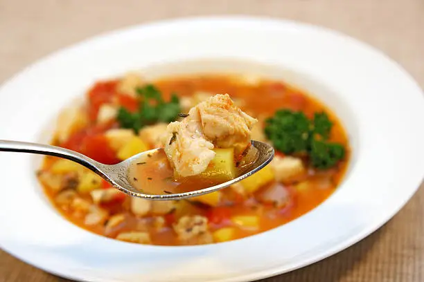 Fishsoup / bouillabaisse with mixed fish, fresh vegetable and potatoes