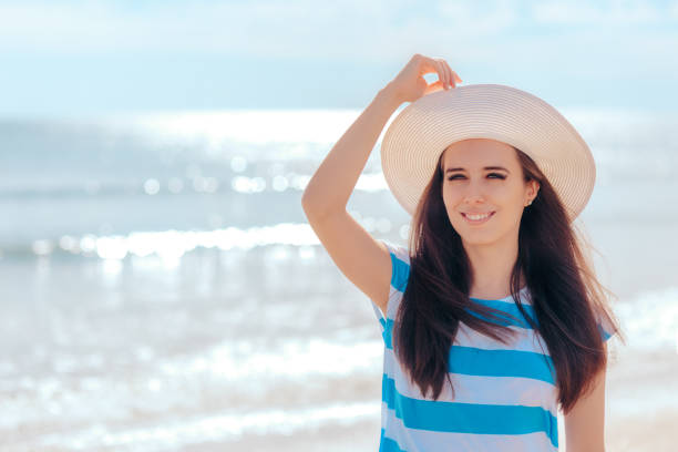 istock Summer Woman with White Straw Sun Hat at the Beach 955103224
