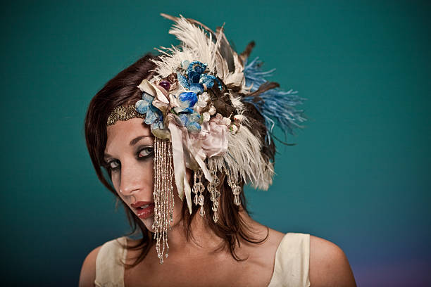 Model Peeking Out from Behind Beautiful Vintage Headpiece stock photo