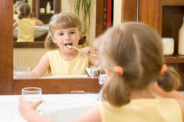 istock Little girl brushing teeth 95510462