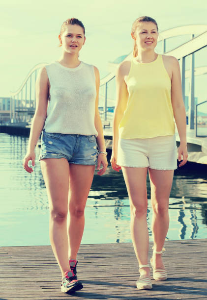 istock young girls standing on berthand and smiling 955105428