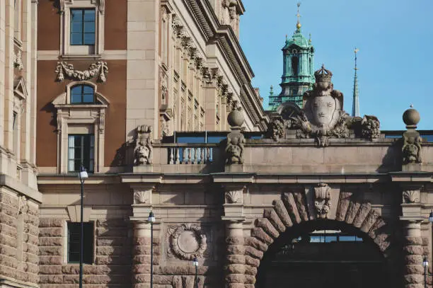 Details of art and decor on Building of The Parliament House of Sweden built in Neoclassical style, with a centered Baroque Revival style facade section, located on nearly half of Helgeandsholmen island, in the Gamla stan, old town district of central Stockholm