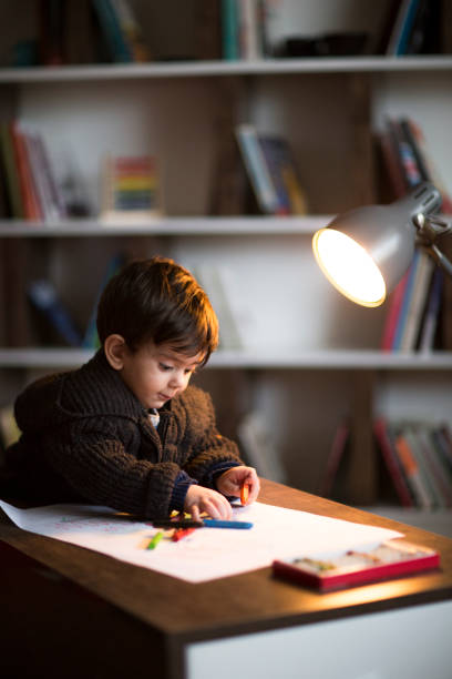 istock Adorable little boy, drawing picture 955112714