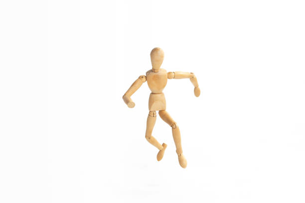 istock A wood figure model in runaway action. 955115486