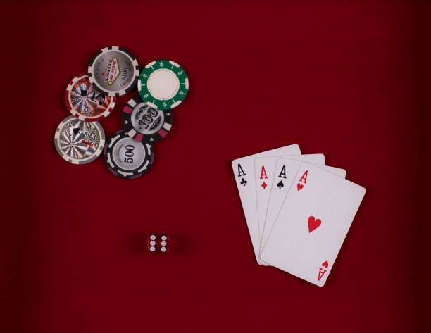 istock Casino chips, playing cards, casino, red background 955115954