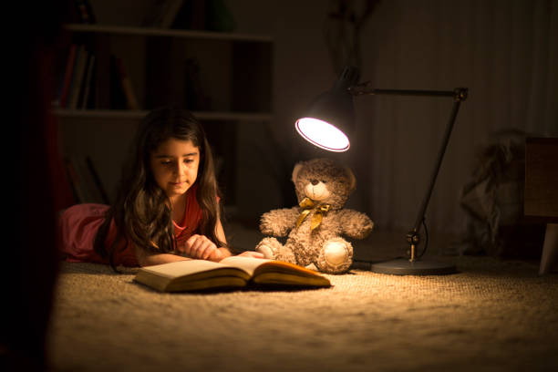 istock Night reading of favorite book 955115968