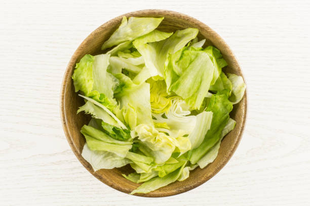 Fresh Raw Iceberg Lettuce on grey wood